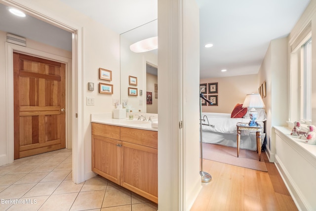 bathroom featuring tile patterned flooring and vanity