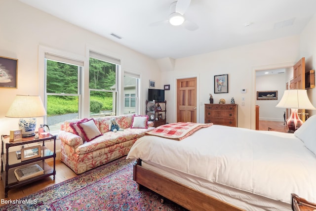 bedroom with hardwood / wood-style floors and ceiling fan