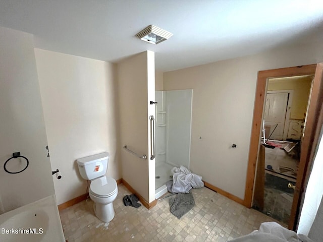 bathroom with toilet and walk in shower