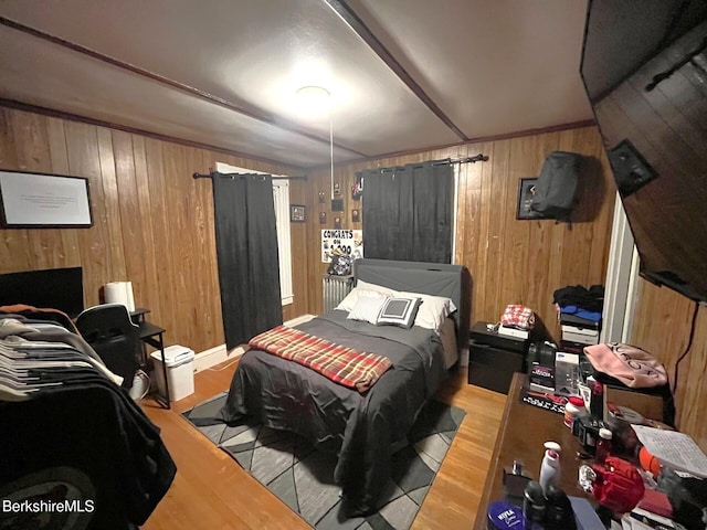 bedroom with wooden walls