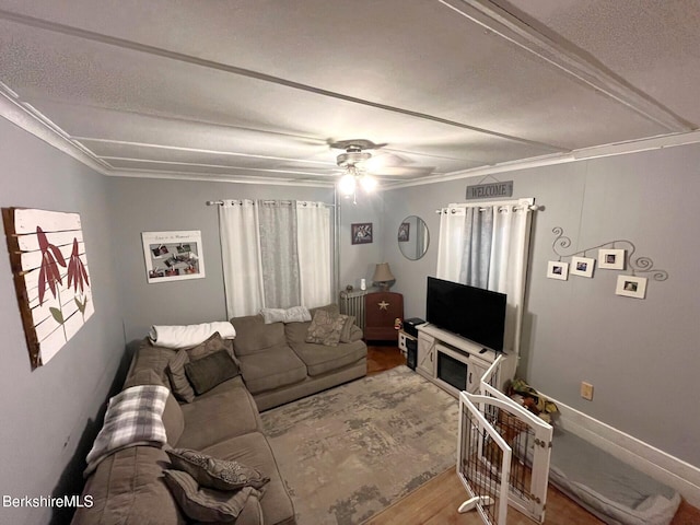 living room with wood-type flooring and ceiling fan