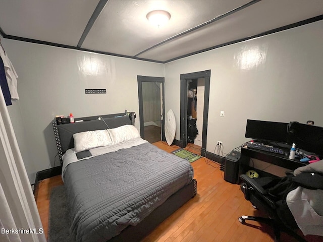 bedroom with hardwood / wood-style floors