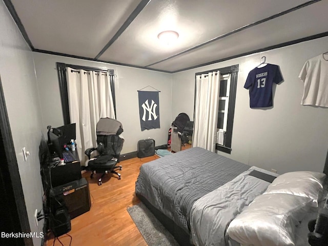 bedroom featuring wood-type flooring