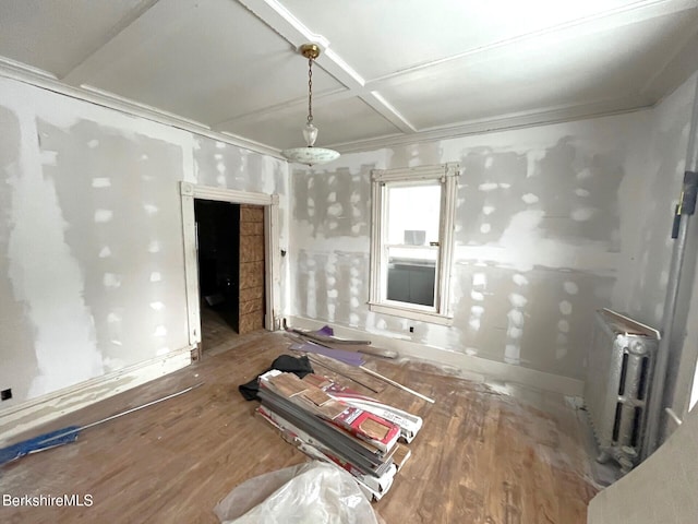 miscellaneous room featuring radiator and coffered ceiling