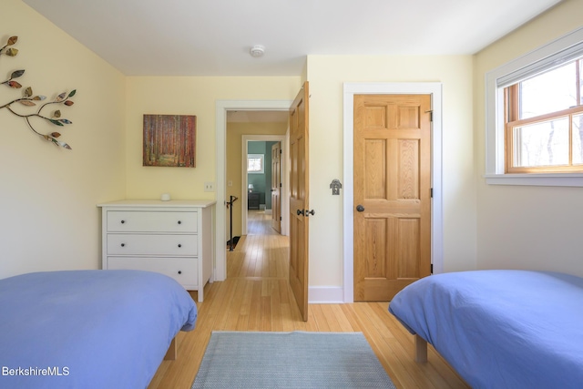 bedroom with light wood-style floors