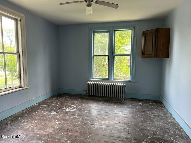27-29 Daniels Ave, Pittsfield, MA 01201 - spare room featuring radiator heating unit, healthy amount of natural light, and a ceiling fan