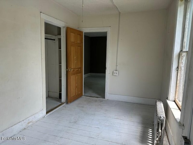 27-29 Daniels Ave, Pittsfield, MA 01201 - unfurnished room with radiator heating unit and light wood-type flooring