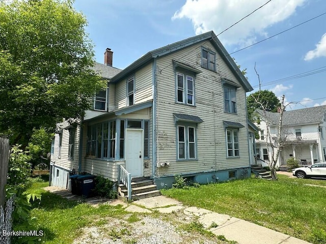 27-29 Daniels Ave, Pittsfield, MA 01201 - view of front of house featuring entry steps, a front yard, and a chimney