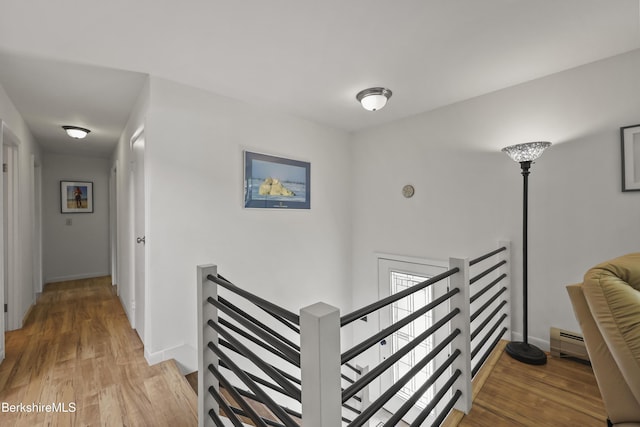4 Birch Hill Rd, Peru, MA 01235 - hall with an upstairs landing, light wood-type flooring, and a baseboard heating unit