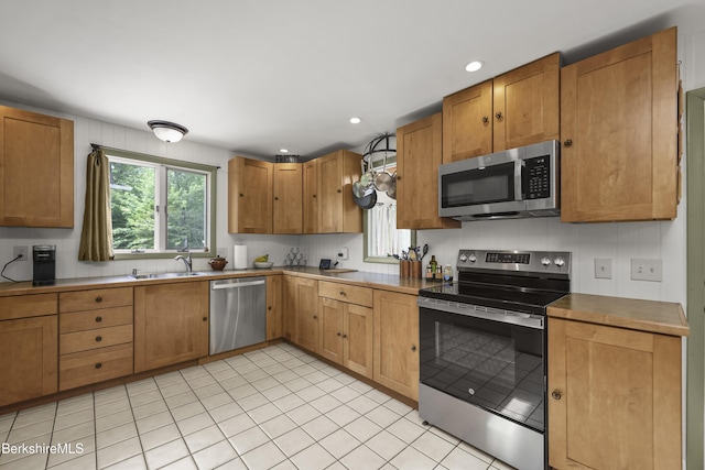 4 Birch Hill Rd, Peru, MA 01235 - kitchen featuring stainless steel appliances, light tile patterned flooring, recessed lighting, and light countertops