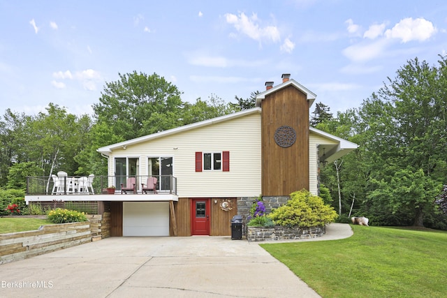 4 Birch Hill Rd, Peru, MA 01235 - view of front of property featuring a chimney, a garage, a front yard, concrete driveway, and a deck