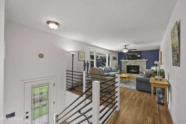 4 Birch Hill Rd, Peru, MA 01235 - living room featuring wood finished floors, ceiling fan, and a stone fireplace