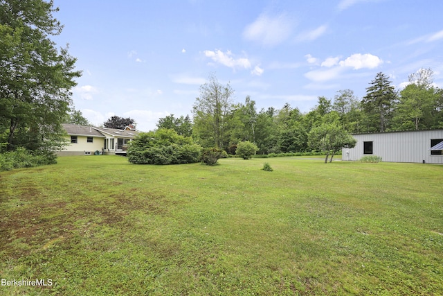4 Birch Hill Rd, Peru, MA 01235 - view of green lawn with a pole building and an outbuilding