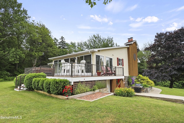 4 Birch Hill Rd, Peru, MA 01235 - view of front of home with a chimney, a deck, and a front yard