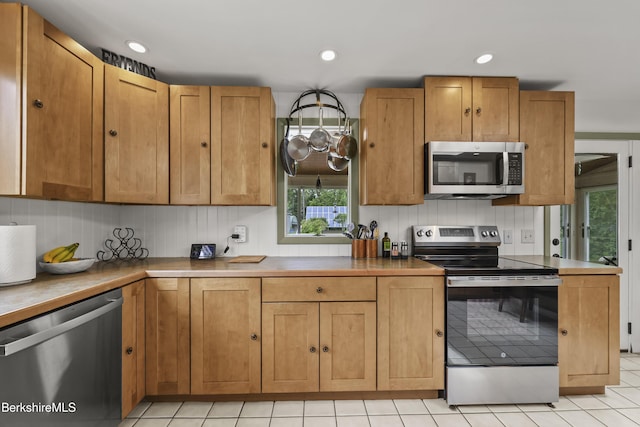 4 Birch Hill Rd, Peru, MA 01235 - kitchen featuring stainless steel appliances, light tile patterned floors, recessed lighting, and brown cabinets