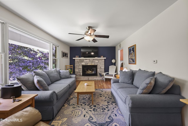 4 Birch Hill Rd, Peru, MA 01235 - living room featuring wood finished floors, a ceiling fan, and a stone fireplace