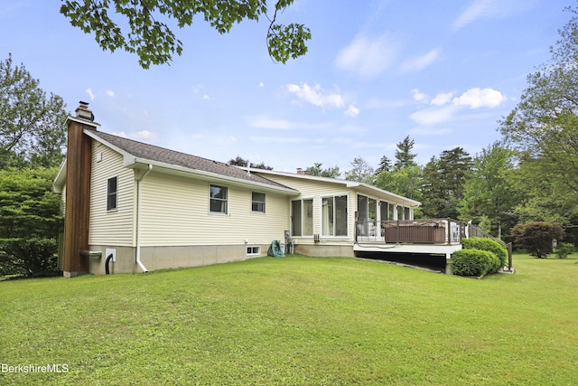 4 Birch Hill Rd, Peru, MA 01235 - back of property with a chimney, a deck, and a lawn