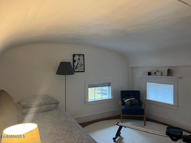132 Sandisfield Rd, Sandisfield, MA 01255 - sitting room with vaulted ceiling, carpet floors, and baseboards