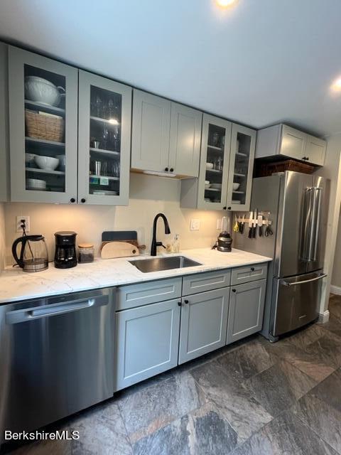 132 Sandisfield Rd, Sandisfield, MA 01255 - kitchen with stainless steel appliances, a sink, gray cabinets, glass insert cabinets, and light stone countertops