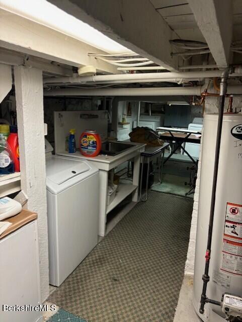 basement featuring washer / clothes dryer and water heater