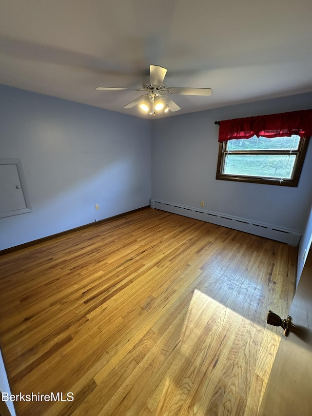 31 Autumn Dr, North Adams, MA 01247 - empty room featuring a baseboard radiator, wood finished floors, and ceiling fan