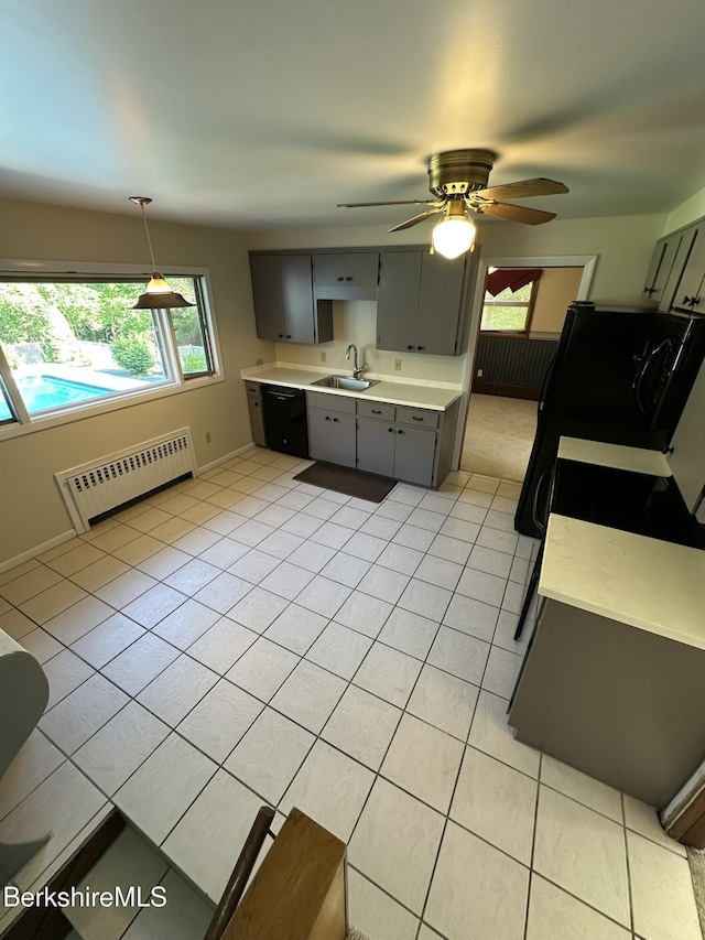 31 Autumn Dr, North Adams, MA 01247 - kitchen featuring light countertops, gray cabinets, plenty of natural light, and radiator heating unit