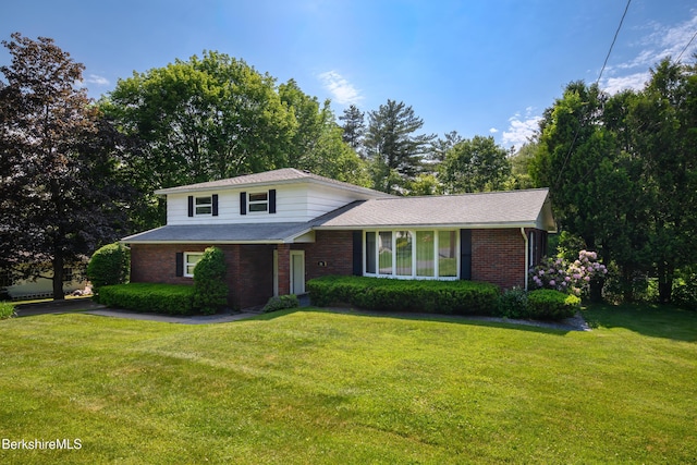 31 Autumn Dr, North Adams, MA 01247 - tri-level home with brick siding and a front yard