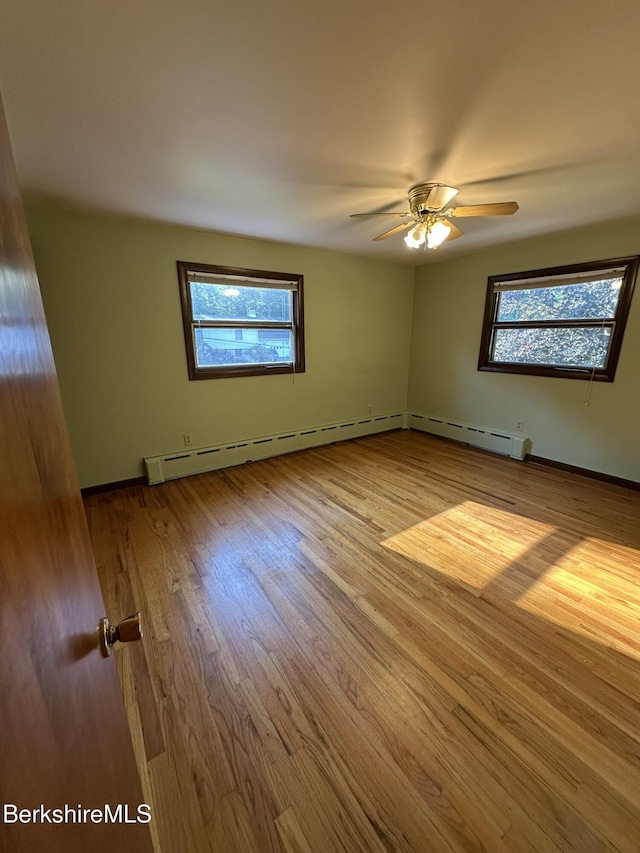 31 Autumn Dr, North Adams, MA 01247 - unfurnished room with wood finished floors, ceiling fan, and a baseboard radiator