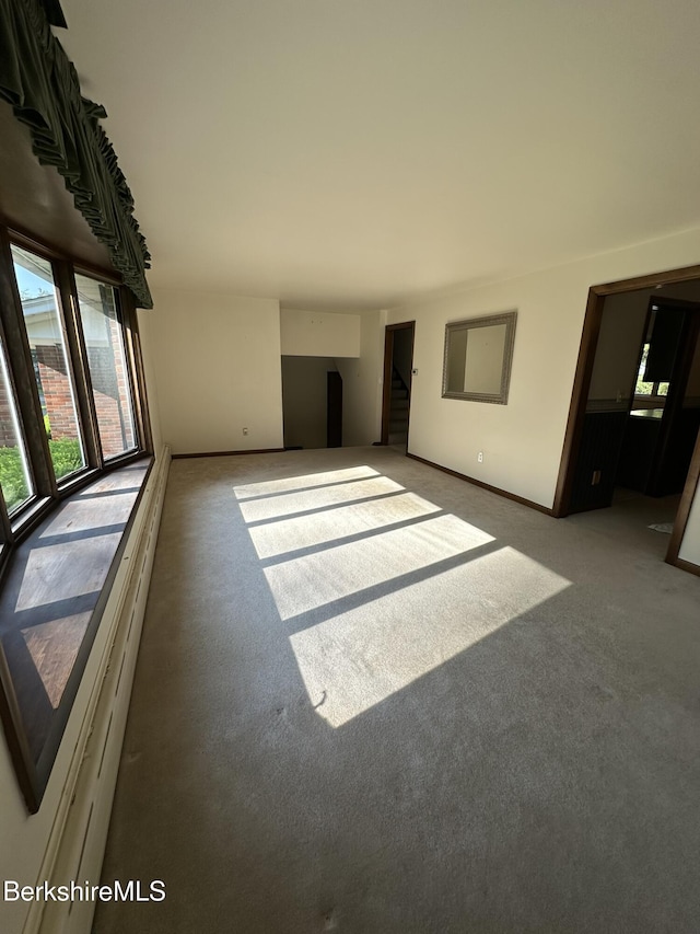31 Autumn Dr, North Adams, MA 01247 - unfurnished living room featuring carpet flooring and stairway
