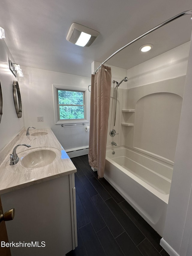 31 Autumn Dr, North Adams, MA 01247 - bathroom featuring a baseboard heating unit, double vanity, shower / bath combo, recessed lighting, and wood finish floors