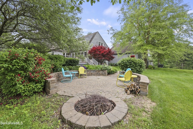 135 E St, Lee, MA 01238 - view of grassy yard with a patio and an outdoor fire pit