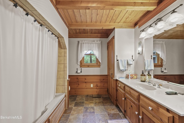 135 E St, Lee, MA 01238 - full bathroom with wooden ceiling, vanity, stone finish floors, shower / bath combo with shower curtain, and wainscoting