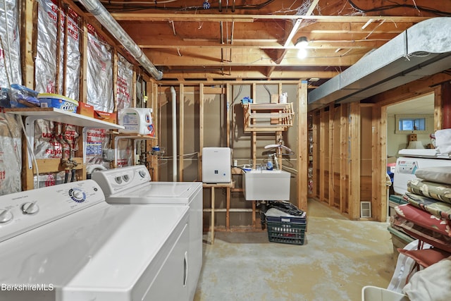 135 E St, Lee, MA 01238 - unfinished basement featuring separate washer and dryer and a sink