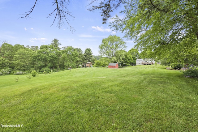 135 E St, Lee, MA 01238 - view of grassy yard with view of wooded area