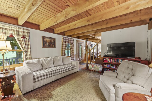 135 E St, Lee, MA 01238 - living area featuring healthy amount of natural light and a wood ceiling with exposed beams