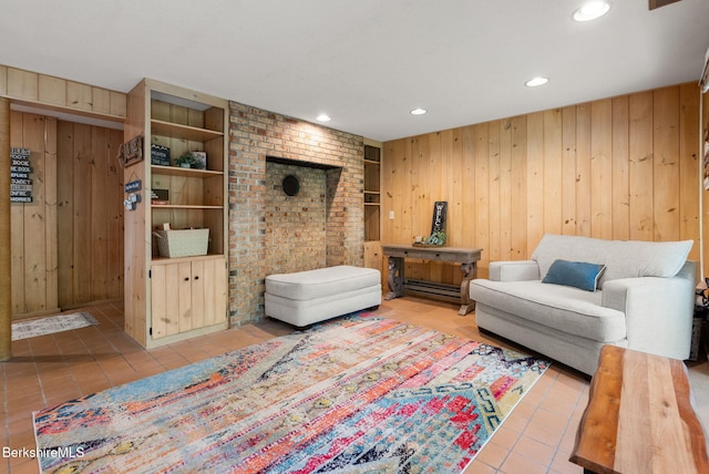 454 Seneca Dr, Becket, MA 01223 - tiled living room featuring wooden walls, recessed lighting, and built in shelves