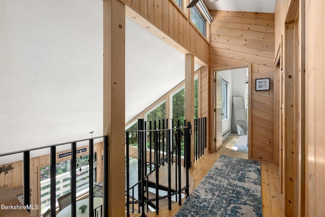 454 Seneca Dr, Becket, MA 01223 - hallway with wooden walls and light wood-style flooring