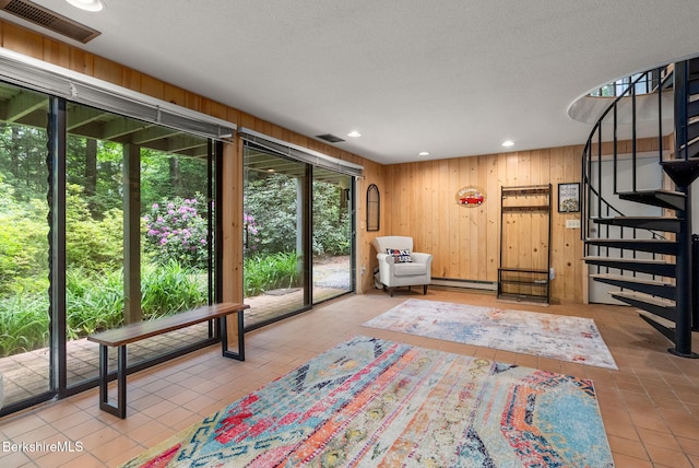 454 Seneca Dr, Becket, MA 01223 - living area with tile patterned flooring, stairway, recessed lighting, wooden walls, and baseboard heating