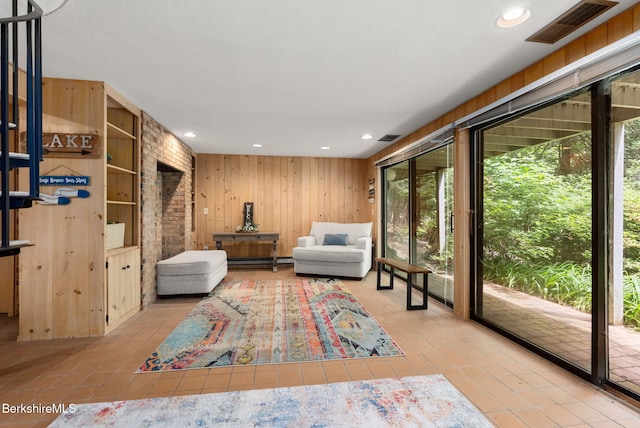 454 Seneca Dr, Becket, MA 01223 - sitting room with wood walls, baseboard heating, tile patterned flooring, and recessed lighting