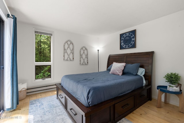 454 Seneca Dr, Becket, MA 01223 - bedroom featuring baseboard heating and light wood-style floors