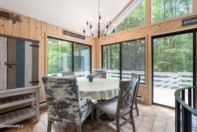 454 Seneca Dr, Becket, MA 01223 - dining area with lofted ceiling, light tile patterned flooring, a chandelier, a baseboard radiator, and wooden walls