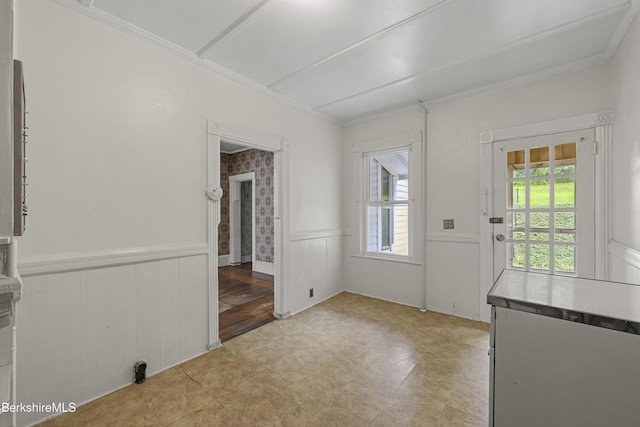 34-36 Crandall St, Adams, MA 01220 - unfurnished dining area featuring a wainscoted wall, ornamental molding, and tile patterned floors