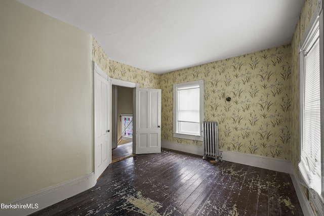 34-36 Crandall St, Adams, MA 01220 - spare room featuring radiator, hardwood / wood-style flooring, and wallpapered walls