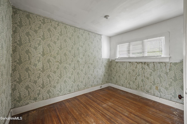 34-36 Crandall St, Adams, MA 01220 - unfurnished room with wood-type flooring and wallpapered walls