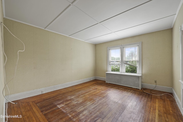 34-36 Crandall St, Adams, MA 01220 - unfurnished room featuring radiator heating unit and hardwood / wood-style flooring