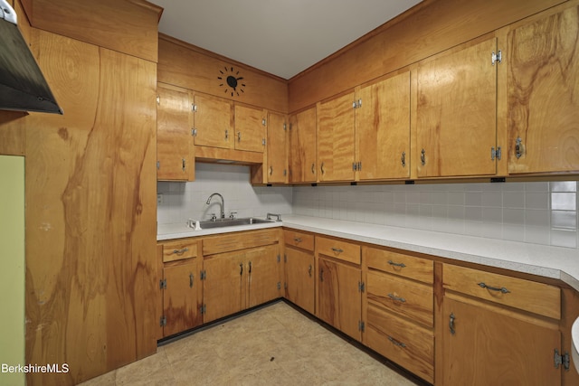 34-36 Crandall St, Adams, MA 01220 - kitchen featuring backsplash, brown cabinetry, light countertops, and light flooring