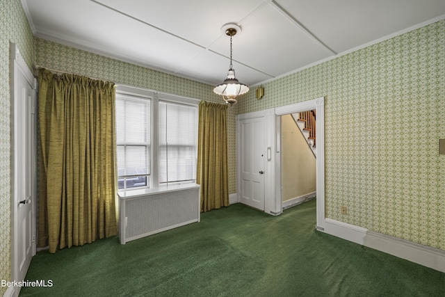 34-36 Crandall St, Adams, MA 01220 - unfurnished dining area featuring wallpapered walls, radiator heating unit, carpet, and crown molding