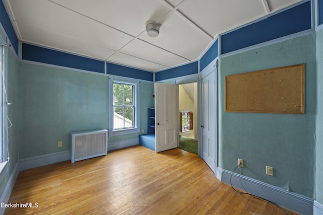 34-36 Crandall St, Adams, MA 01220 - unfurnished bedroom with radiator and wood finished floors