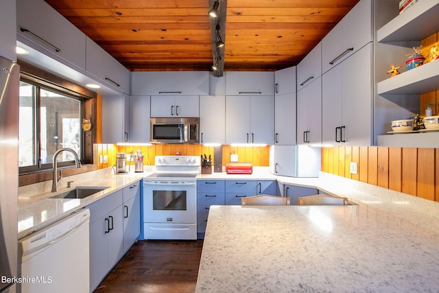 kitchen featuring light stone counters, wood ceiling, white appliances, dark wood-type flooring, and sink