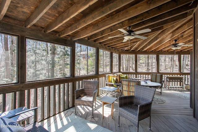 sunroom featuring ceiling fan